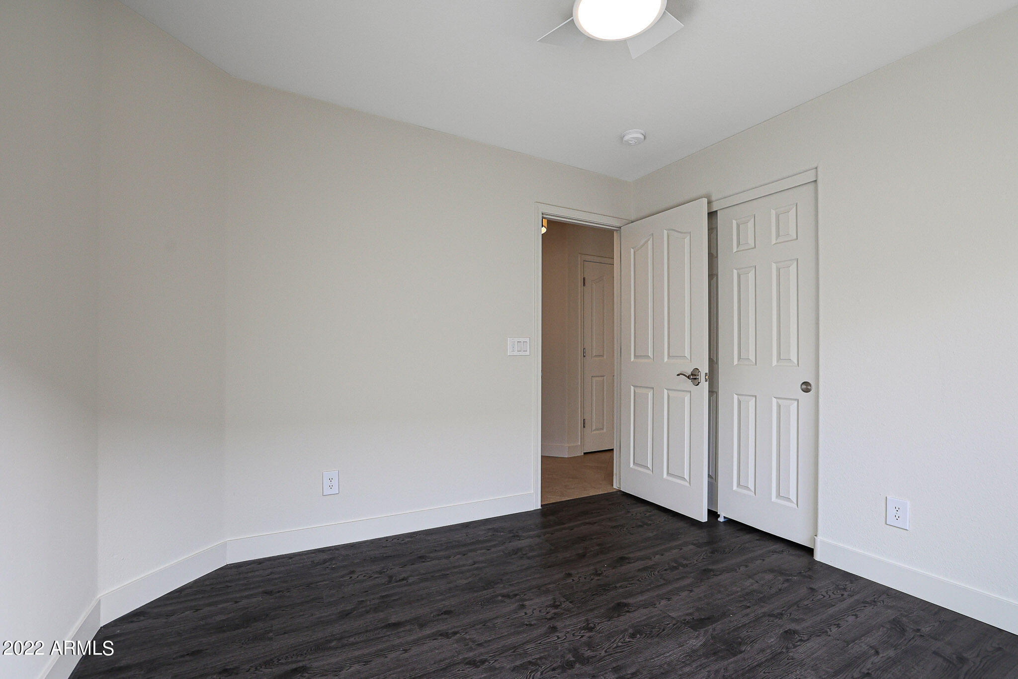 4316 East Rowel Road Phoenix, AZ 85050 - Photo 29 of 40 a view of an empty room and wooden floor