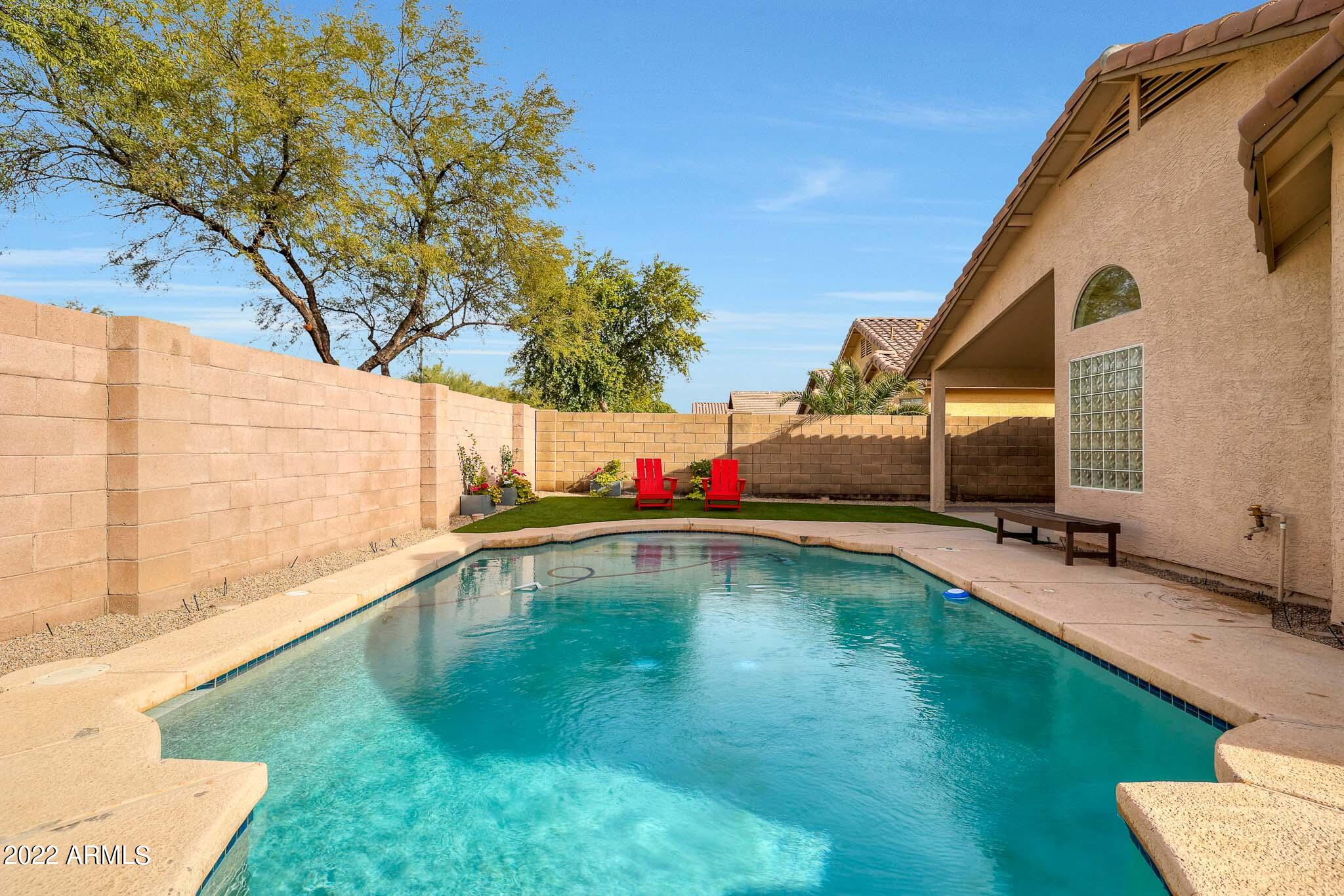 4316 East Rowel Road Phoenix, AZ 85050 - Photo 34 of 40 a swimming pool with outdoor seating and yard