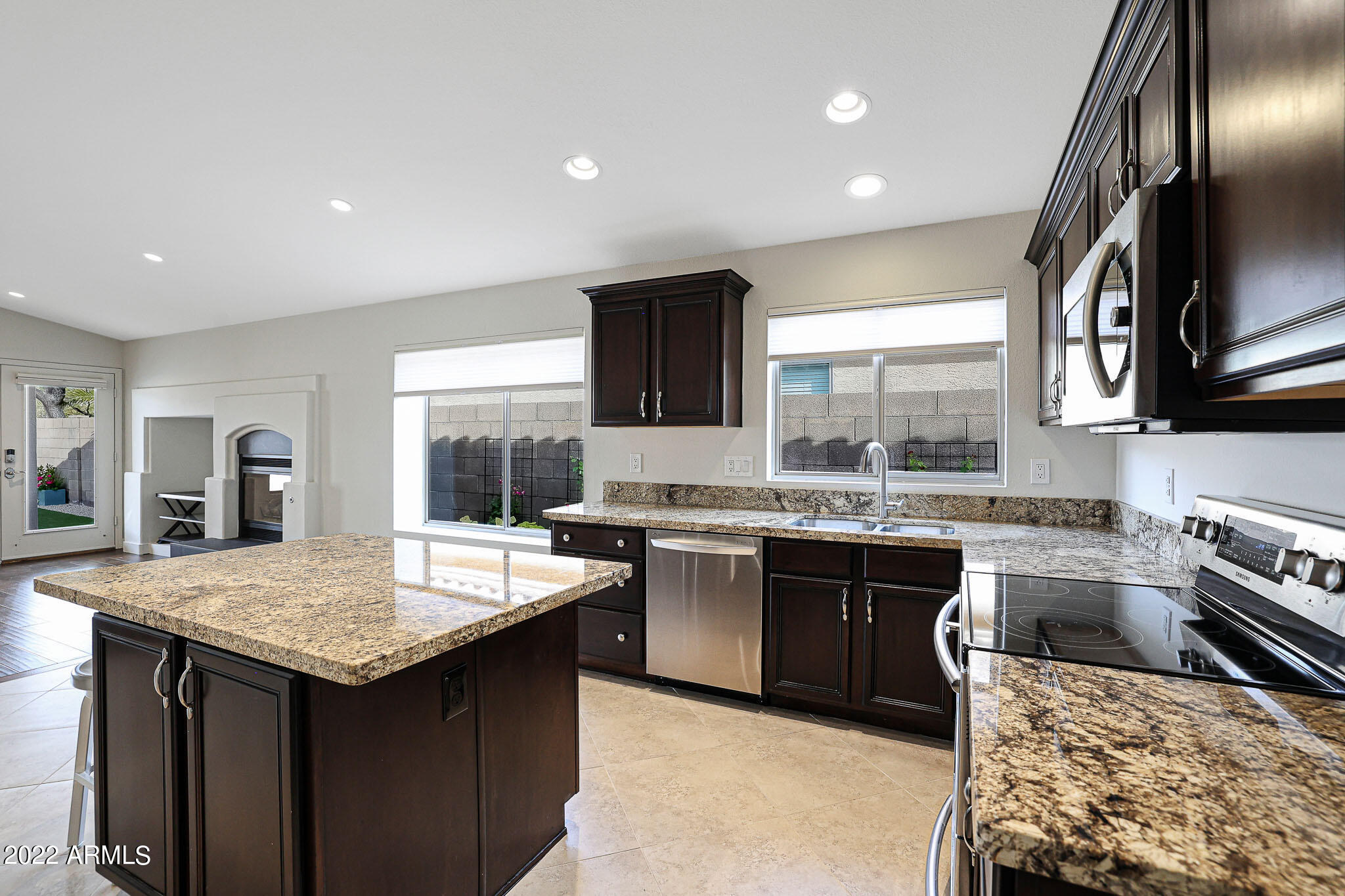 4316 East Rowel Road Phoenix, AZ 85050 - Photo 6 of 40 a kitchen with a stove sink and microwave