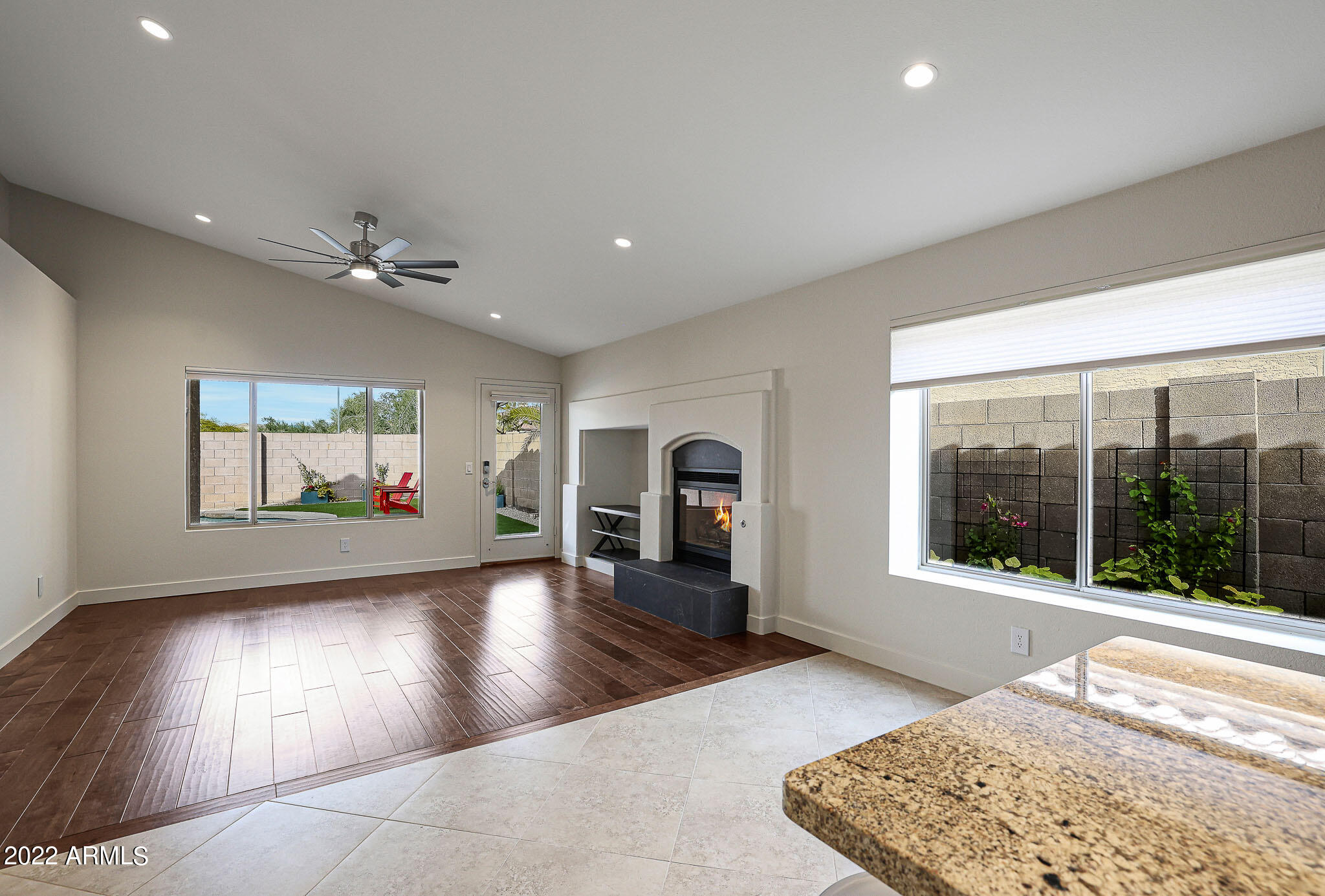 4316 East Rowel Road Phoenix, AZ 85050 - Photo 8 of 40 a view of a hall with wooden floor and a rug