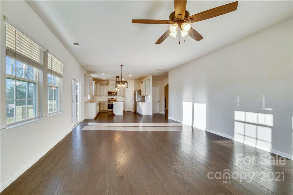 18121 Kalabash Road, Unit 195 Charlotte, NC 28278 - Photo 12 of 39 a view of a livingroom with a ceiling fan and window