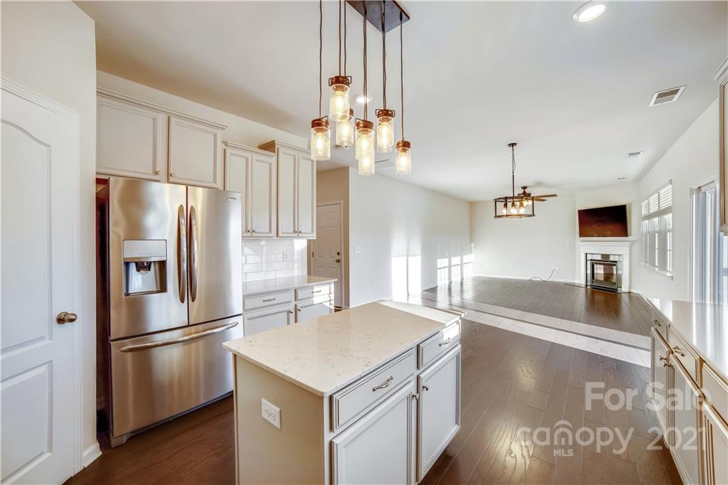 18121 Kalabash Road, Unit 195 Charlotte, NC 28278 - Photo 15 of 39 a kitchen with stainless steel appliances a refrigerator sink and stove