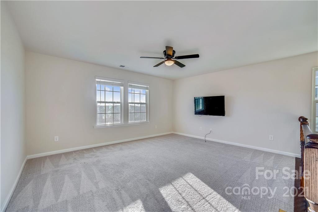 18121 Kalabash Road, Unit 195 Charlotte, NC 28278 - Photo 17 of 39 a view of an empty room with a window and a kitchen