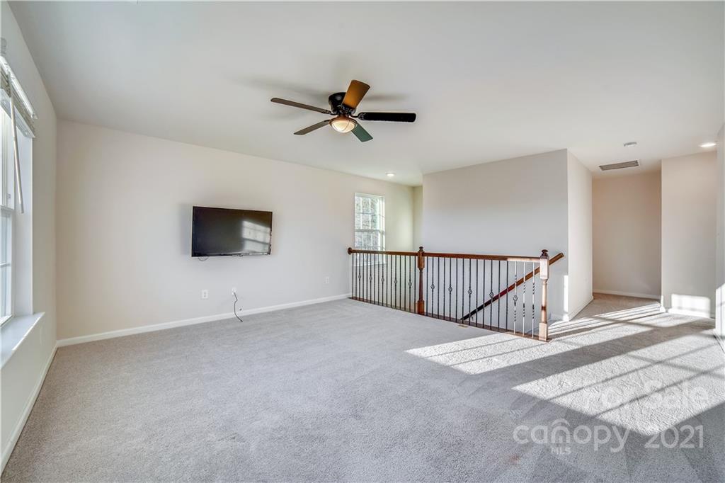 18121 Kalabash Road, Unit 195 Charlotte, NC 28278 - Photo 18 of 39 a view of a livingroom with a ceiling fan and window