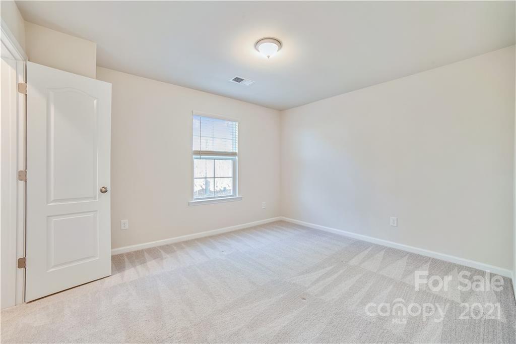 18121 Kalabash Road, Unit 195 Charlotte, NC 28278 - Photo 19 of 39 a view of an empty room with a window