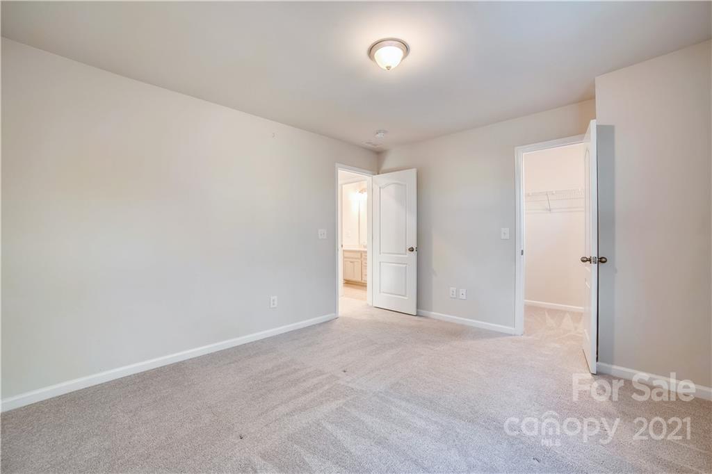 18121 Kalabash Road, Unit 195 Charlotte, NC 28278 - Photo 20 of 39 a view of an empty room and a window