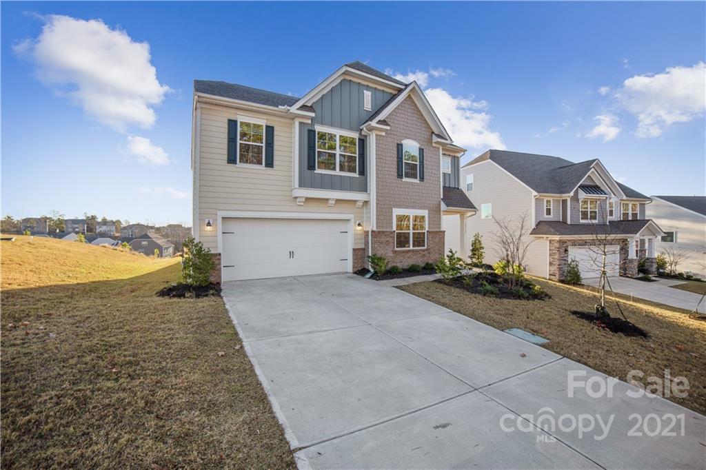18121 Kalabash Road, Unit 195 Charlotte, NC 28278 - Photo 2 of 39 a front view of a house with a yard and lake view