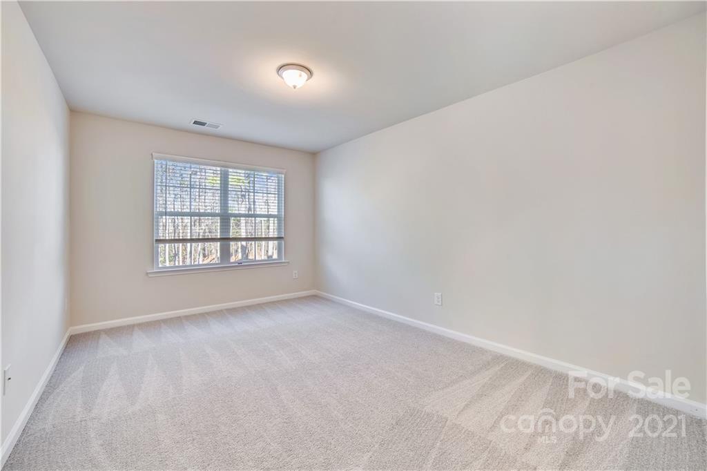 18121 Kalabash Road, Unit 195 Charlotte, NC 28278 - Photo 21 of 39 an empty room with windows