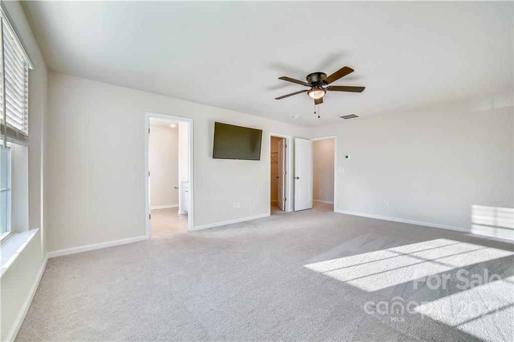 18121 Kalabash Road, Unit 195 Charlotte, NC 28278 - Photo 28 of 39 a view of a livingroom with a ceiling fan and window