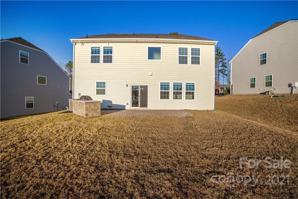 18121 Kalabash Road, Unit 195 Charlotte, NC 28278 - Photo 33 of 39 a front view of a house with a big yard