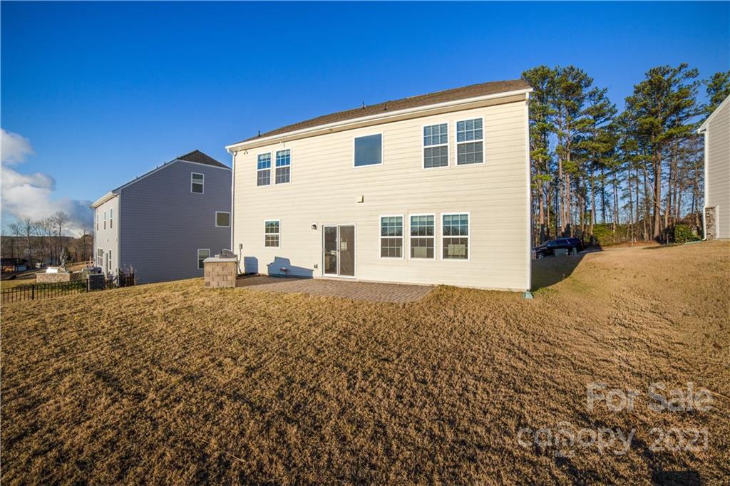 18121 Kalabash Road, Unit 195 Charlotte, NC 28278 - Photo 34 of 39 a view of a house with a yard