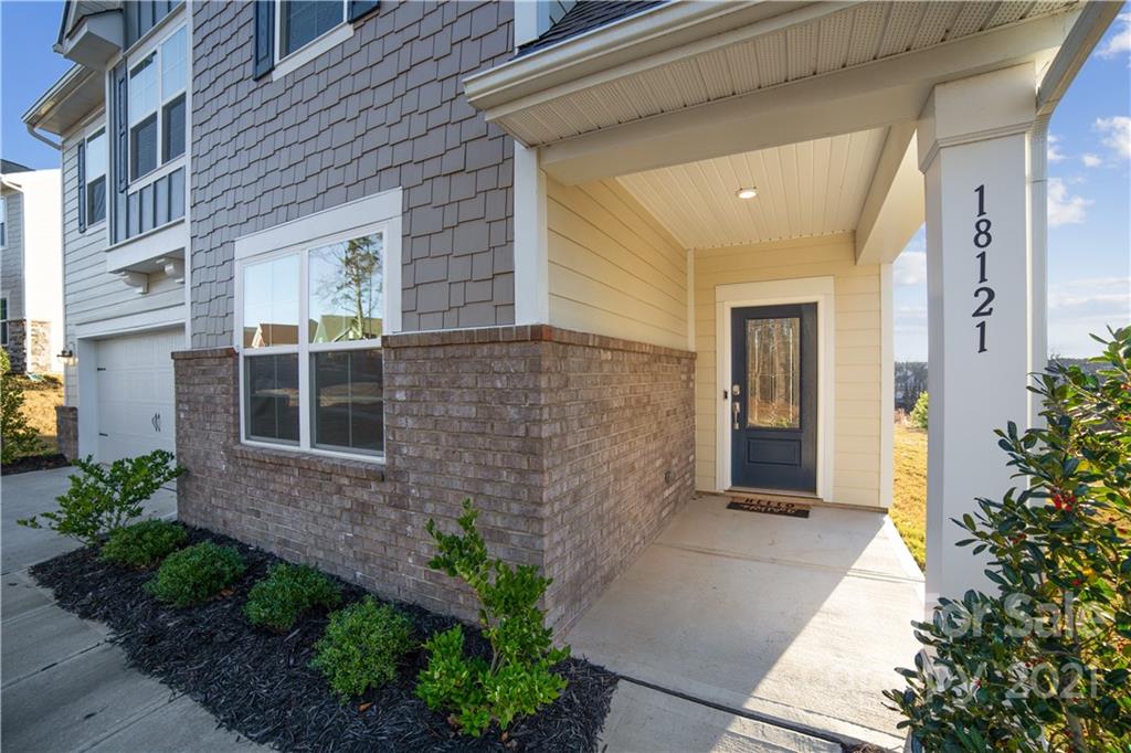 18121 Kalabash Road, Unit 195 Charlotte, NC 28278 - Photo 4 of 39 a view of a brick house with a large windows