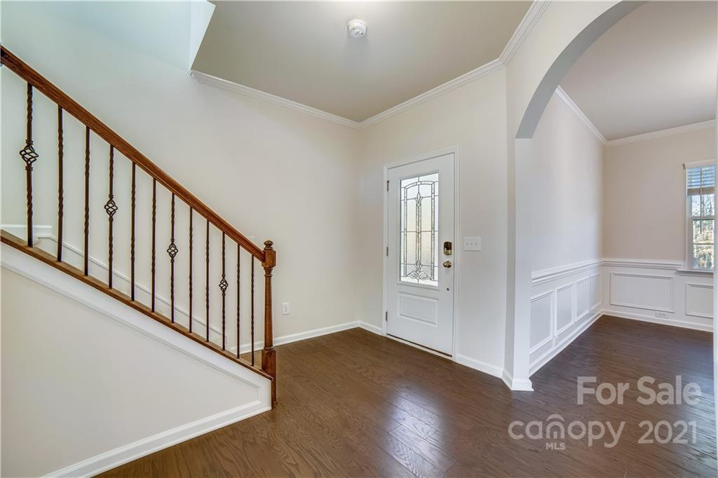 18121 Kalabash Road, Unit 195 Charlotte, NC 28278 - Photo 6 of 39 a view of a hallway with wooden floor and stairs