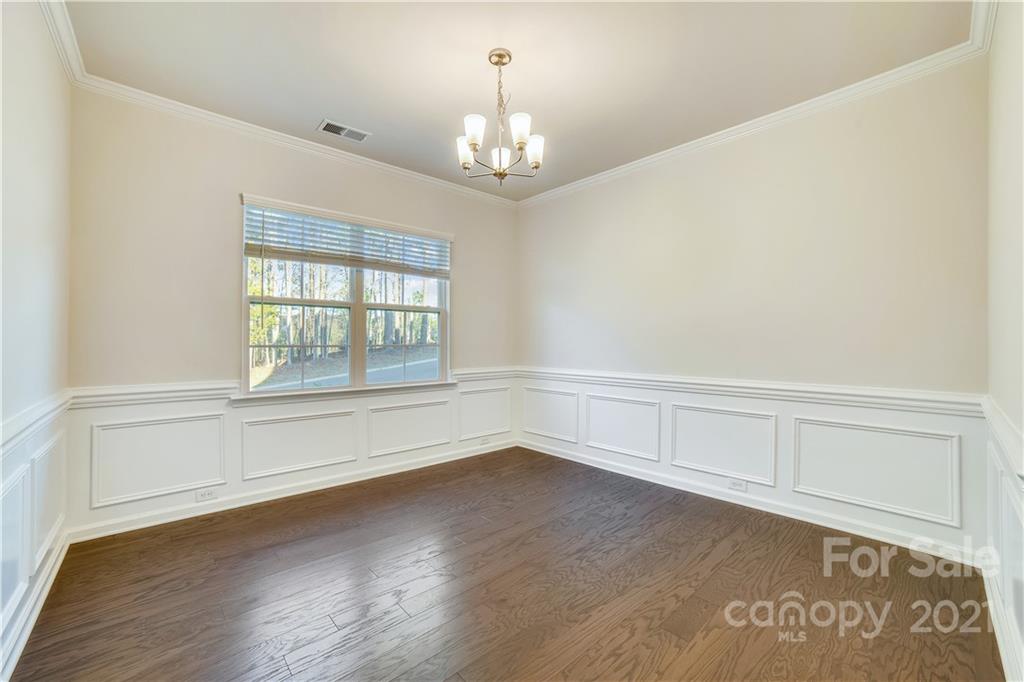 18121 Kalabash Road, Unit 195 Charlotte, NC 28278 - Photo 8 of 39 wooden floor in an empty room with a window