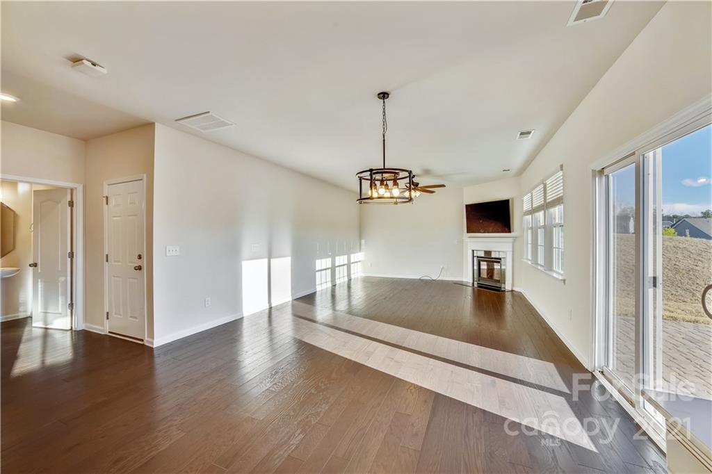 18121 Kalabash Road, Unit 195 Charlotte, NC 28278 - Photo 9 of 39 a view of kitchen and hall with wooden floor
