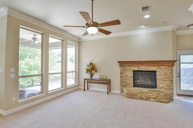 a view of a kitchen with a sink and a refrigerator