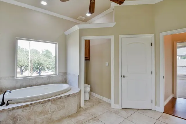 a bedroom with a bed and a dresser with the shoe rack