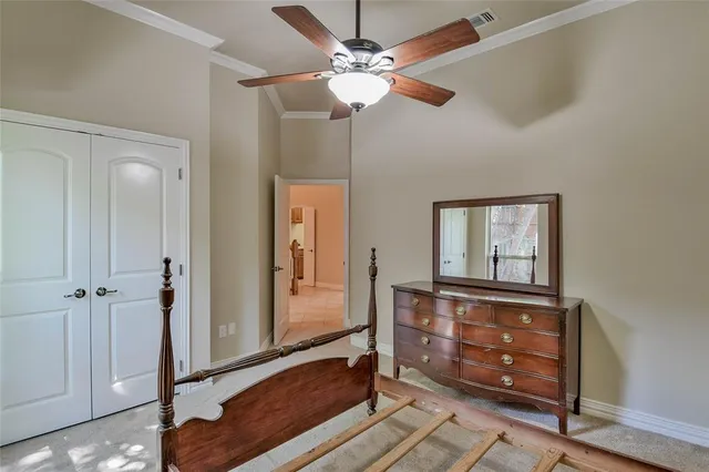 a view of room with a ceiling fan and window