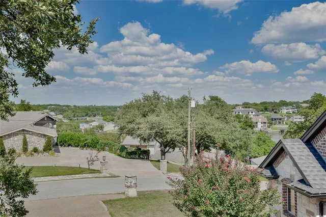 a view of a garden from a balcony