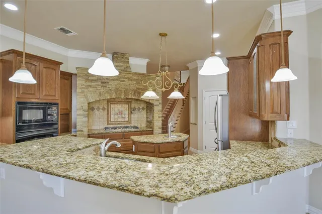 a kitchen with a table and chairs