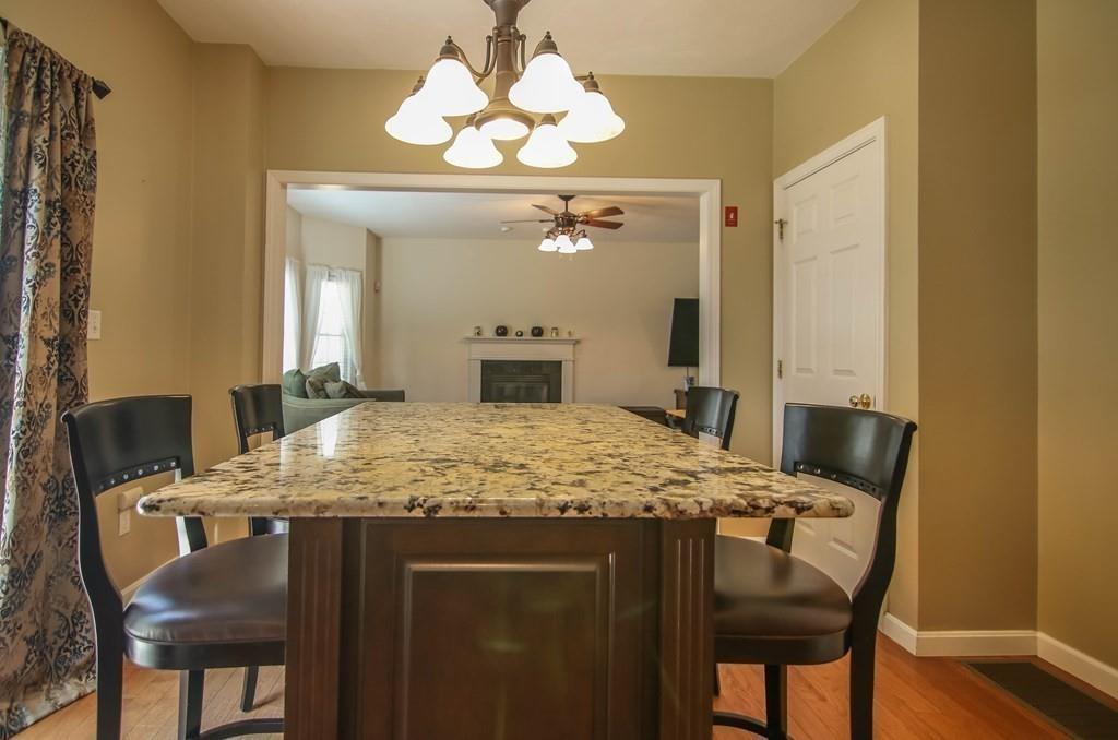 23 Tannery Road Sturbridge, MA 01518 - Photo 8 of 41 a view of a dining room with furniture and wooden floor