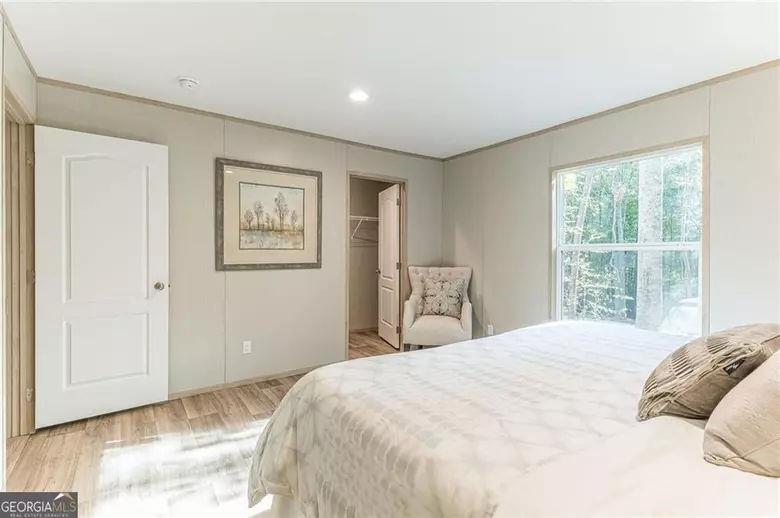 643 Old Ridge Road Demorest, GA 30535 - Photo 41 of 56 a bedroom with a large bed and a window