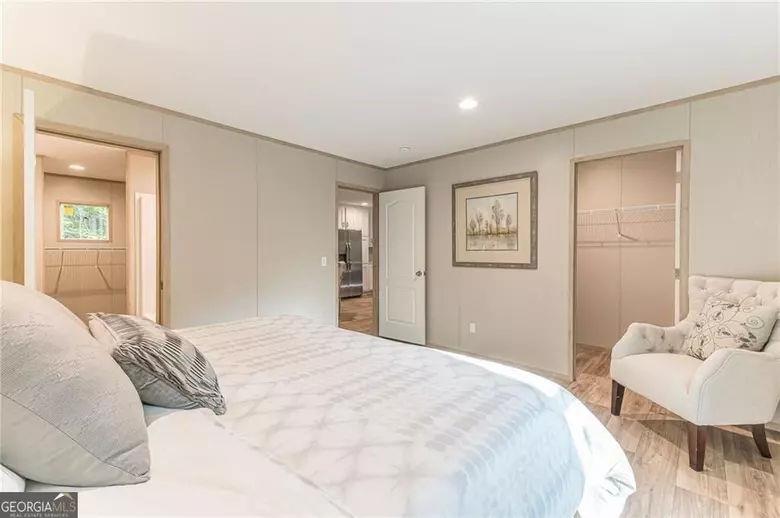 643 Old Ridge Road Demorest, GA 30535 - Photo 42 of 56 a bedroom with a large bed and a couch