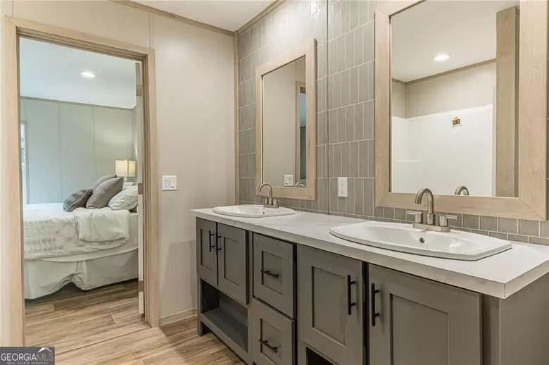 643 Old Ridge Road Demorest, GA 30535 - Photo 45 of 56 a spacious bathroom with a double vanity sink and a mirror
