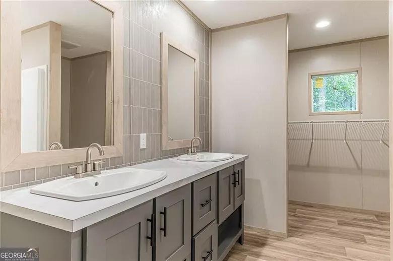 643 Old Ridge Road Demorest, GA 30535 - Photo 46 of 56 a bathroom with a sink and a mirror