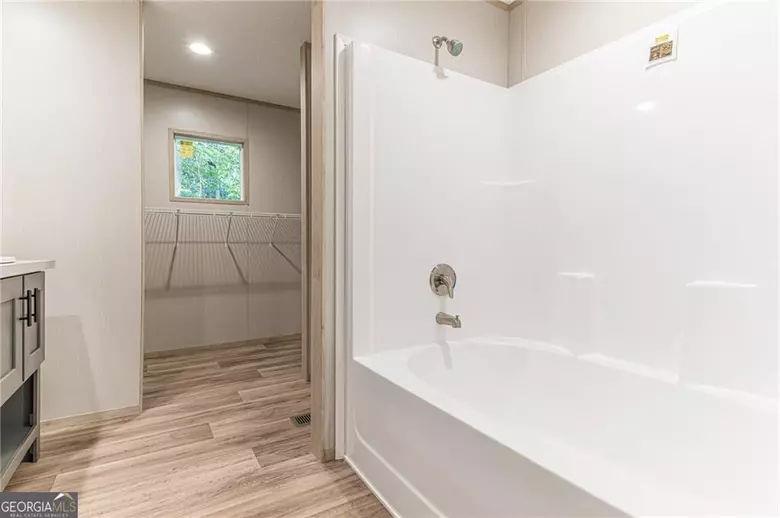 643 Old Ridge Road Demorest, GA 30535 - Photo 48 of 56 a bathroom with a bathtub and shower
