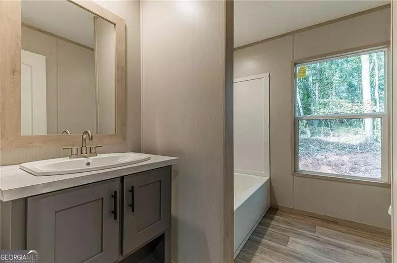 643 Old Ridge Road Demorest, GA 30535 - Photo 53 of 56 a bathroom with a sink and a mirror