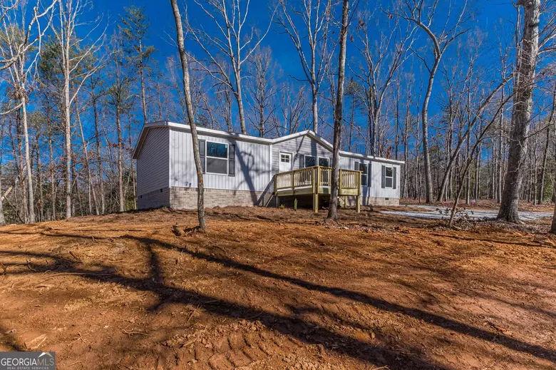 643 Old Ridge Road Demorest, GA 30535 - Photo 9 of 56 a house with trees in front of it