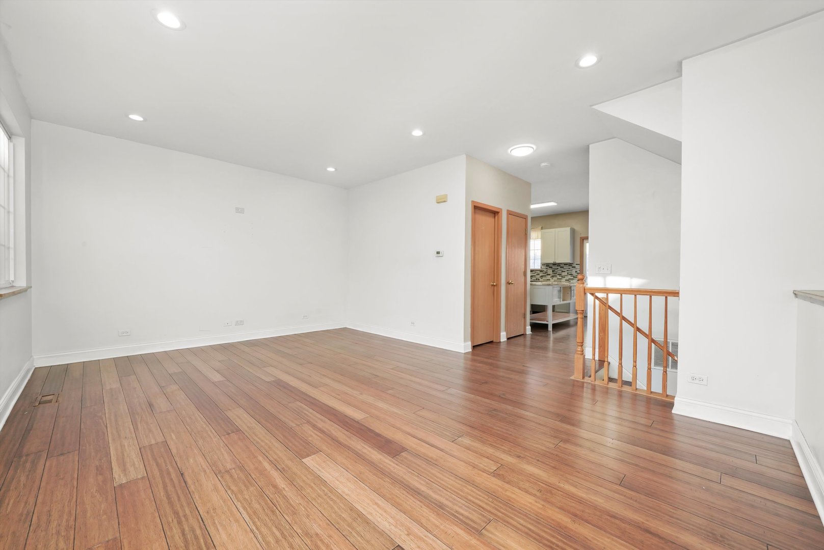 409 Evergreen Circle, Unit 4 Gilberts, IL 60136 - Photo 2 of 42 a view of empty room with wooden floor