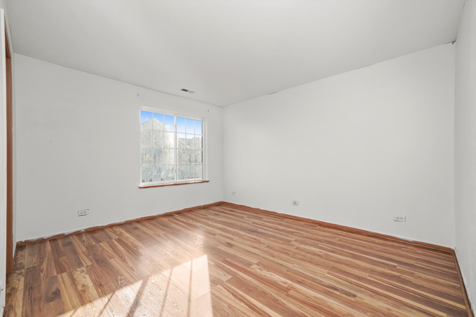 409 Evergreen Circle, Unit 4 Gilberts, IL 60136 - Photo 22 of 42 a view of empty room with wooden floor