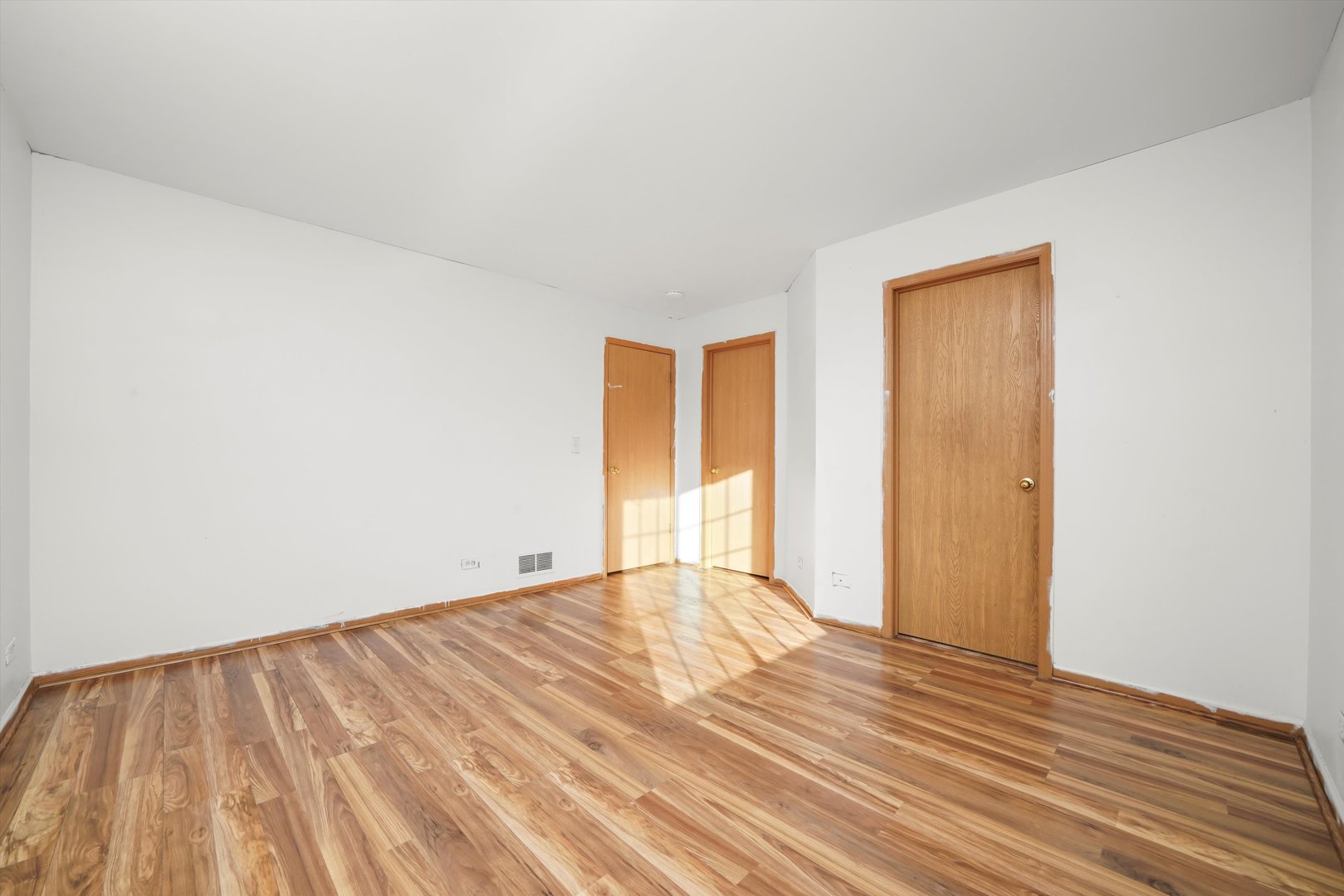 409 Evergreen Circle, Unit 4 Gilberts, IL 60136 - Photo 24 of 42 a view of an empty room with wooden floor and a window