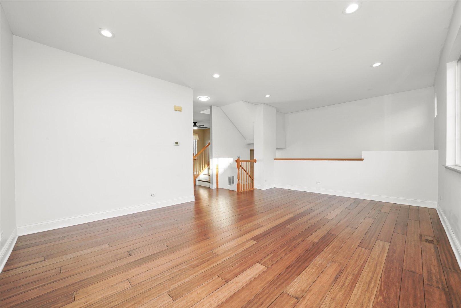409 Evergreen Circle, Unit 4 Gilberts, IL 60136 - Photo 3 of 42 a view of empty room with wooden floor