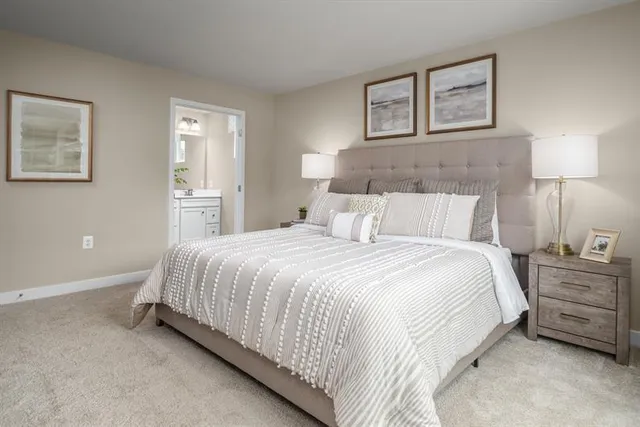 a bedroom with a bed and a night stand