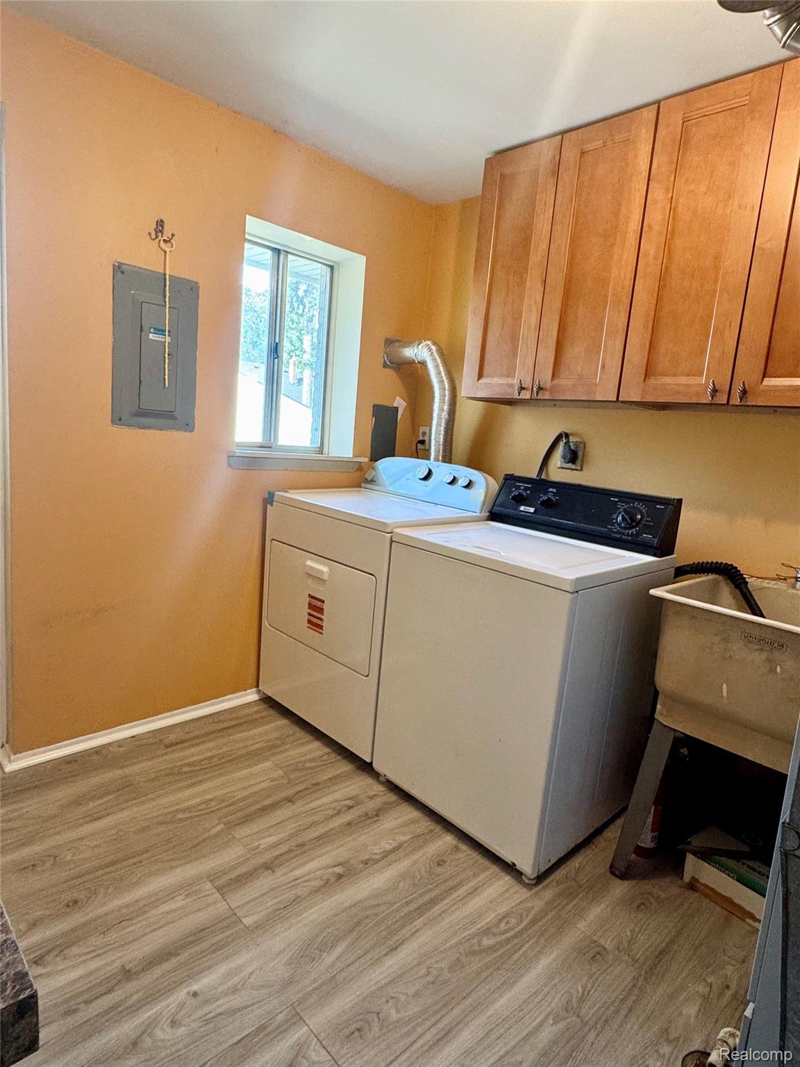 308 North Rochester Road Clawson, MI 48017 - Photo 15 of 16 Wood-finish flooring with overhead cabinetry and a utility sink