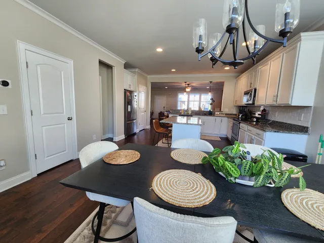 a kitchen with a table and chairs