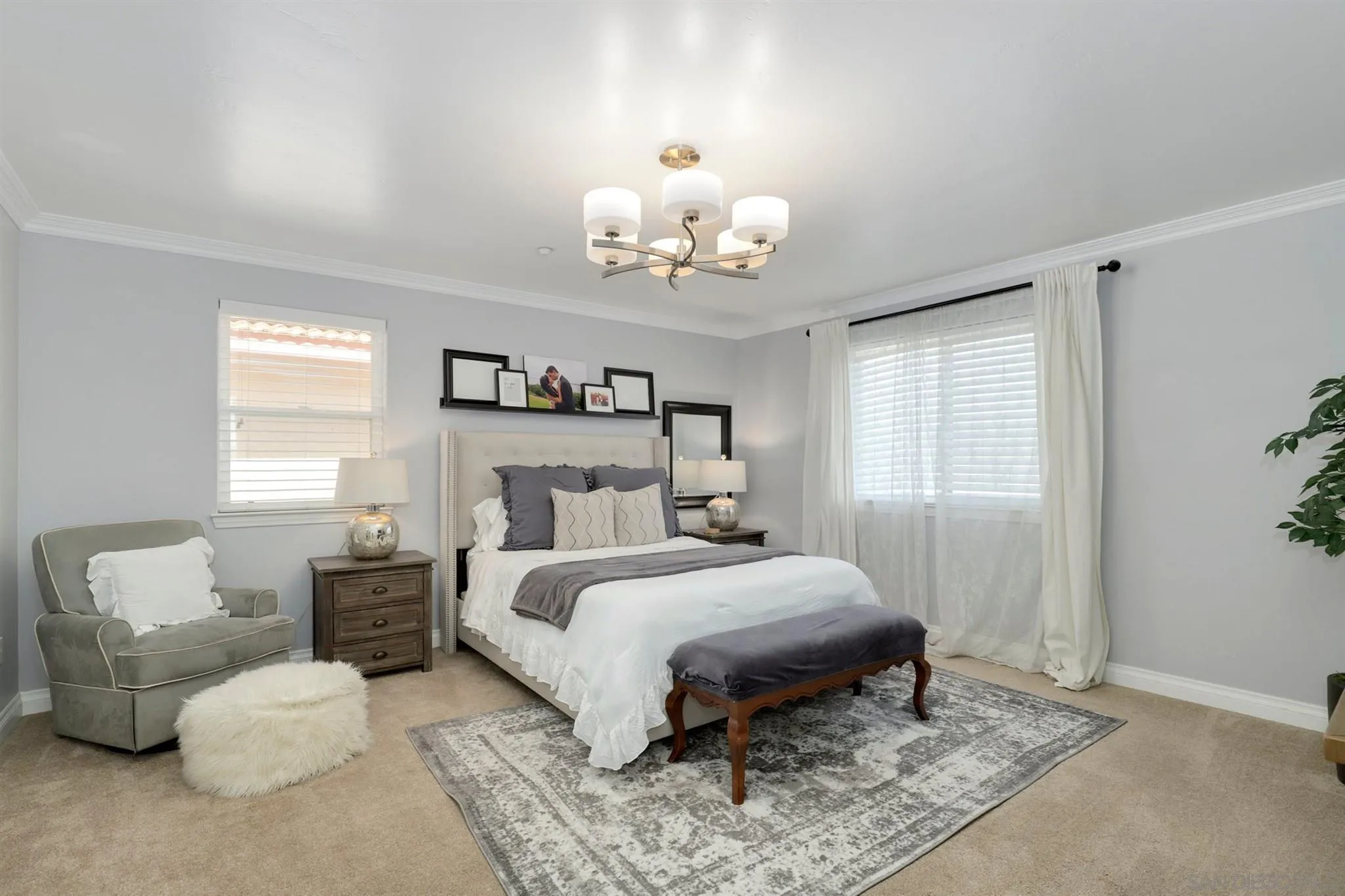 7949 Winter View Court El Cajon, CA 92021 - Photo 13 of 27 a bedroom with a bed and a chandelier