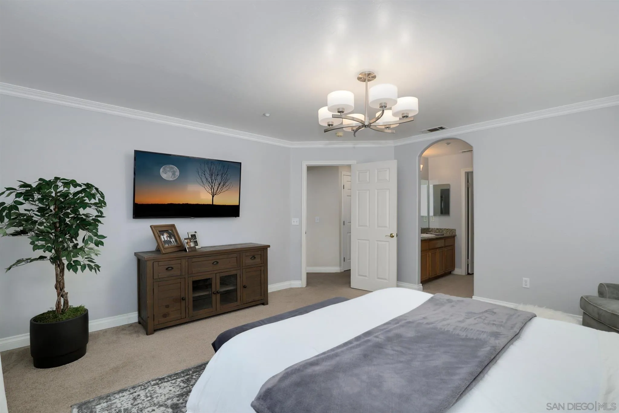 7949 Winter View Court El Cajon, CA 92021 - Photo 14 of 27 a bedroom with bed and a chandelier