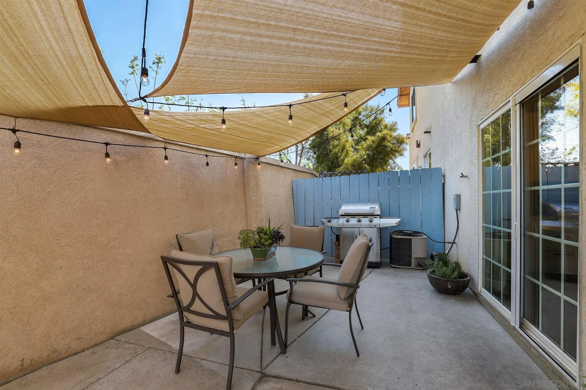 7949 Winter View Court El Cajon, CA 92021 - Photo 20 of 27 a view of a patio with table and chairs and potted plants