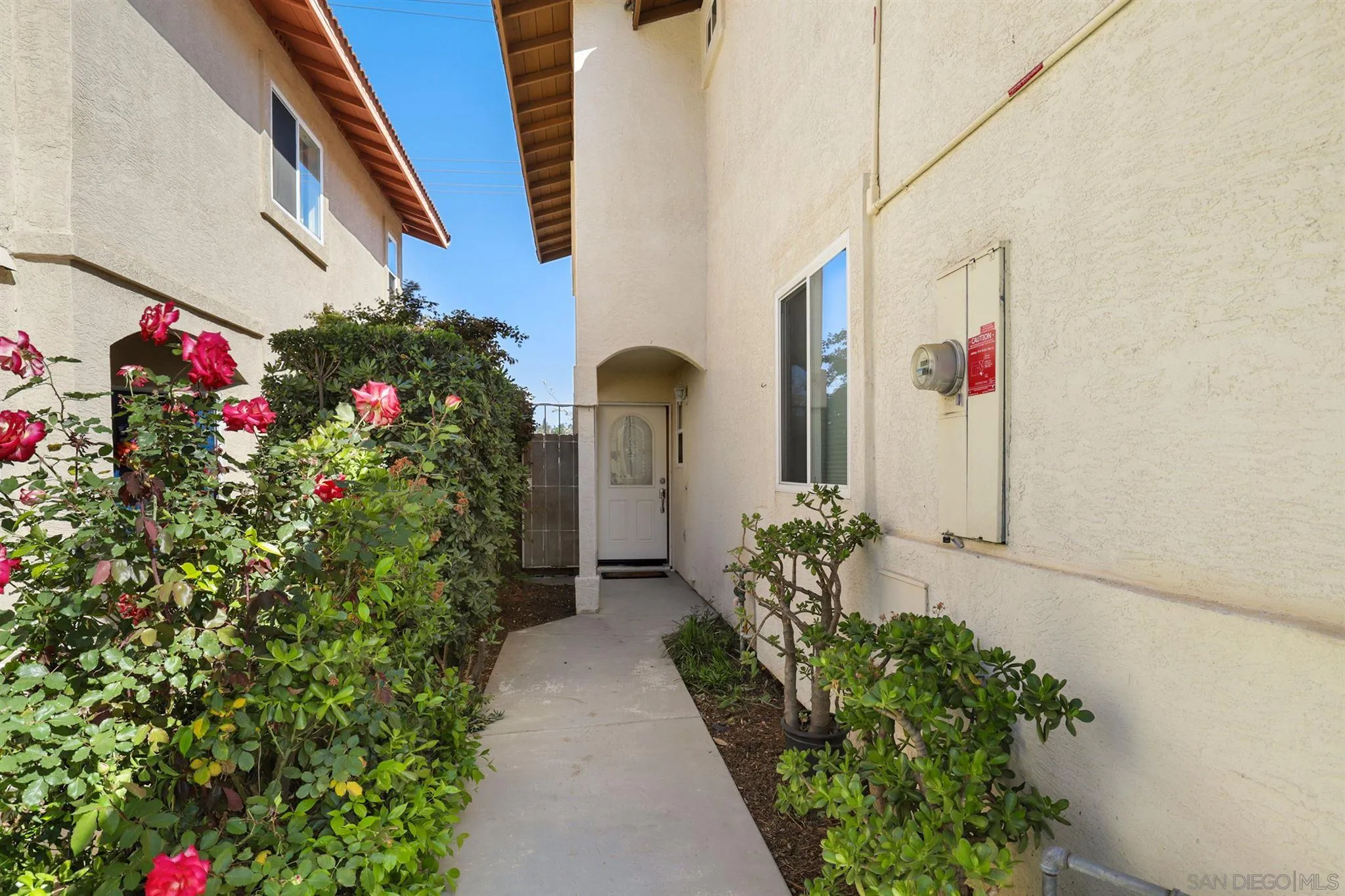 7949 Winter View Court El Cajon, CA 92021 - Photo 21 of 27 a front view of a house with flowers