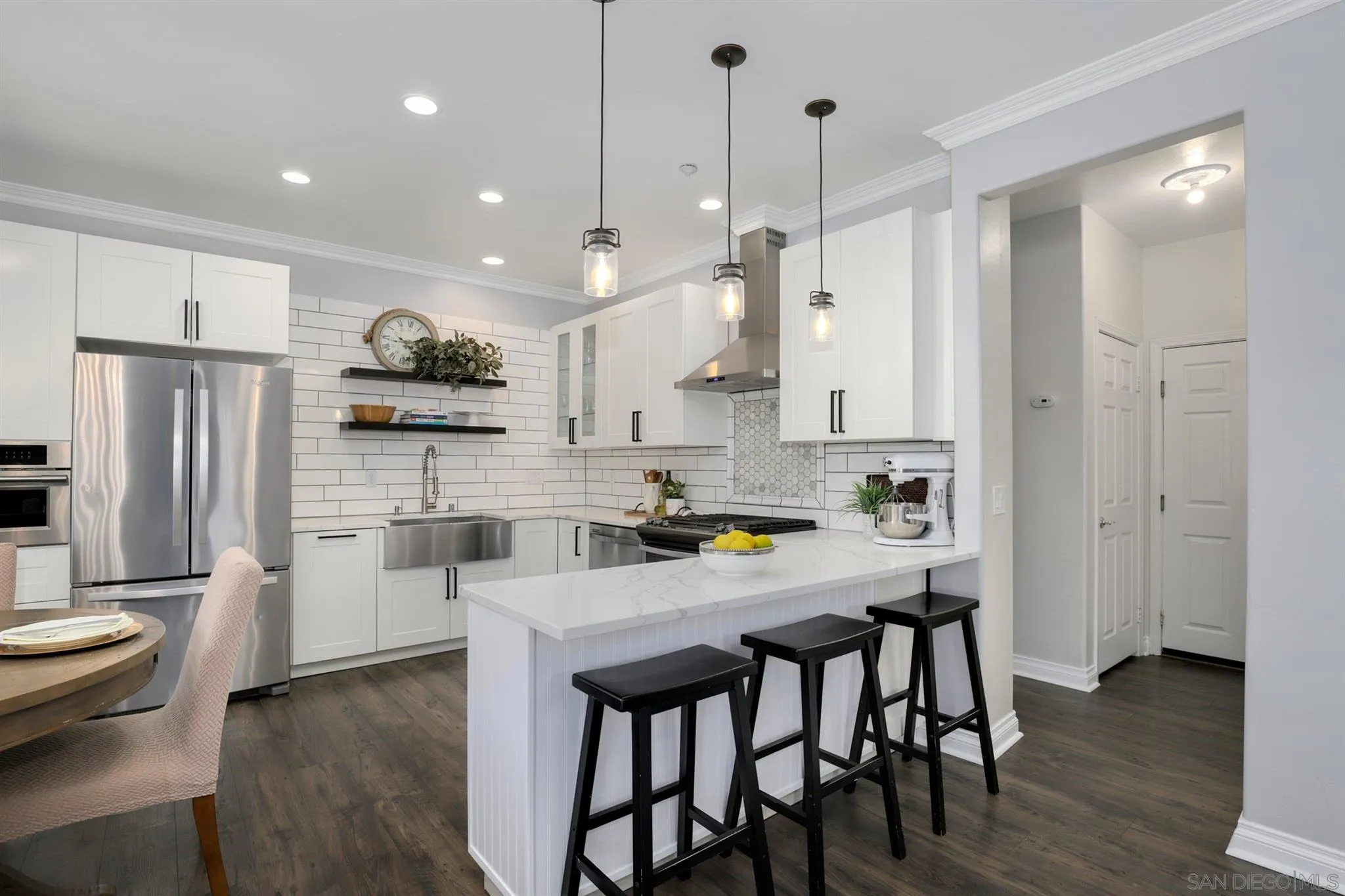 7949 Winter View Court El Cajon, CA 92021 - Photo 4 of 27 a kitchen with stainless steel appliances granite countertop a stove a refrigerator a kitchen island a sink and a refrigerator