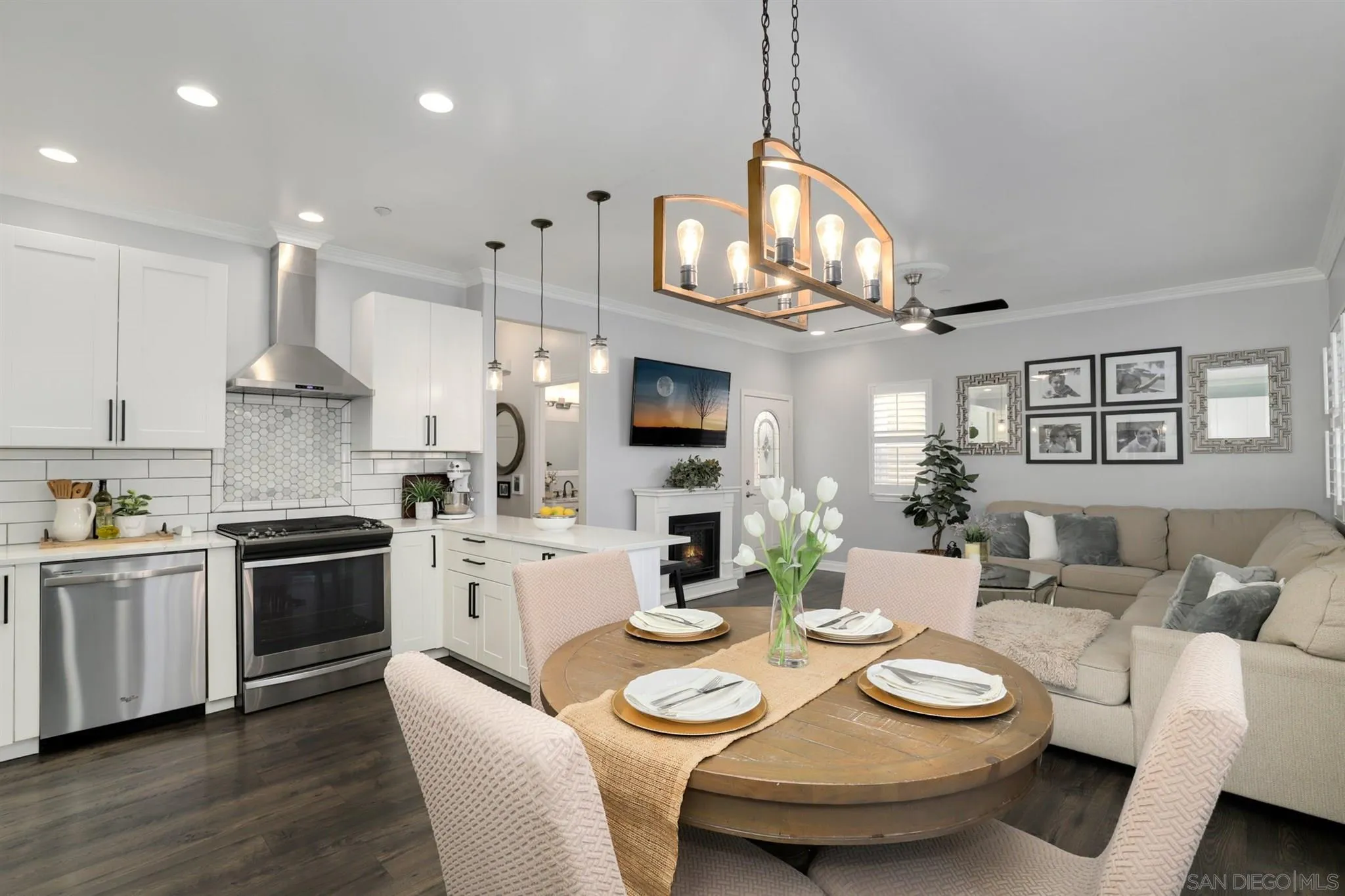 7949 Winter View Court El Cajon, CA 92021 - Photo 7 of 27 a view of a dining room with furniture a kitchen and chandelier