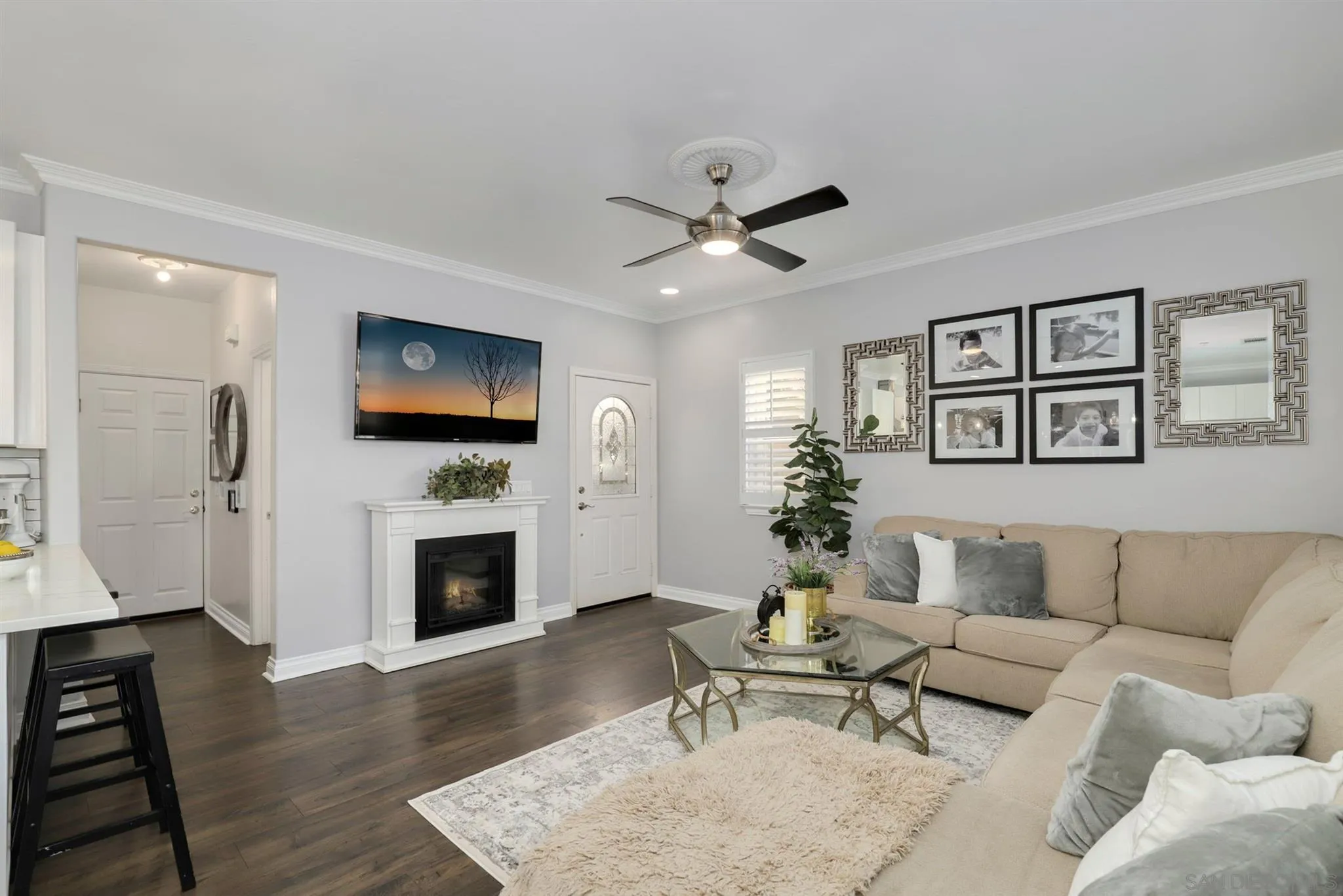 7949 Winter View Court El Cajon, CA 92021 - Photo 8 of 27 a living room with furniture flat screen tv and a fireplace