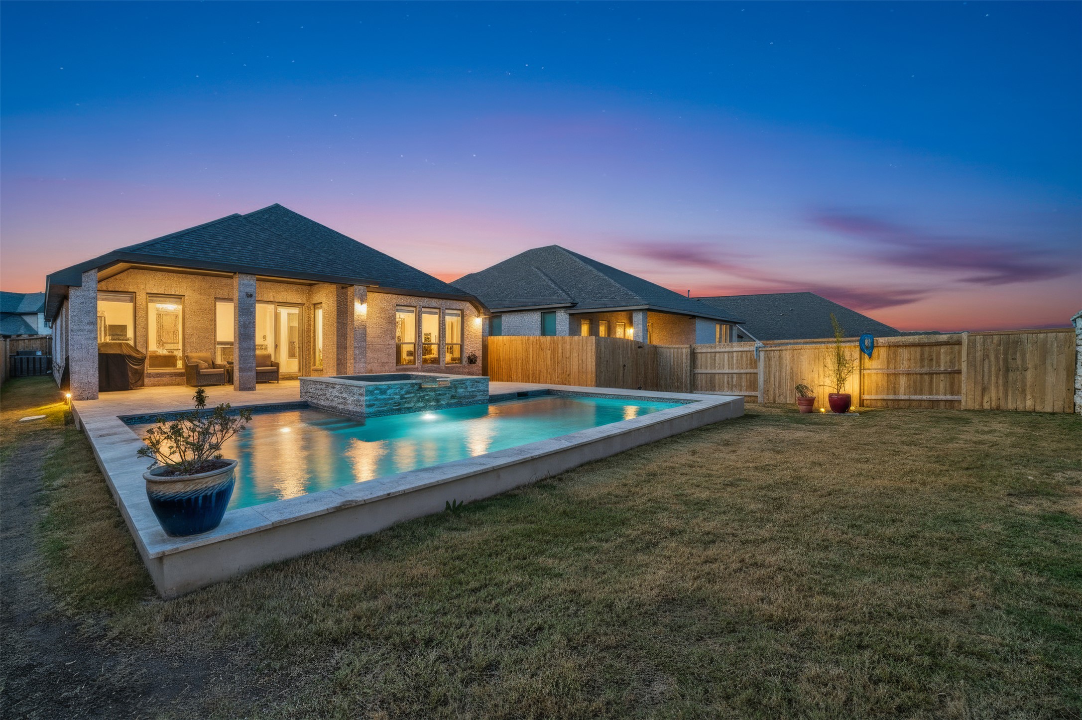 a view of an house with backyard space and balcony