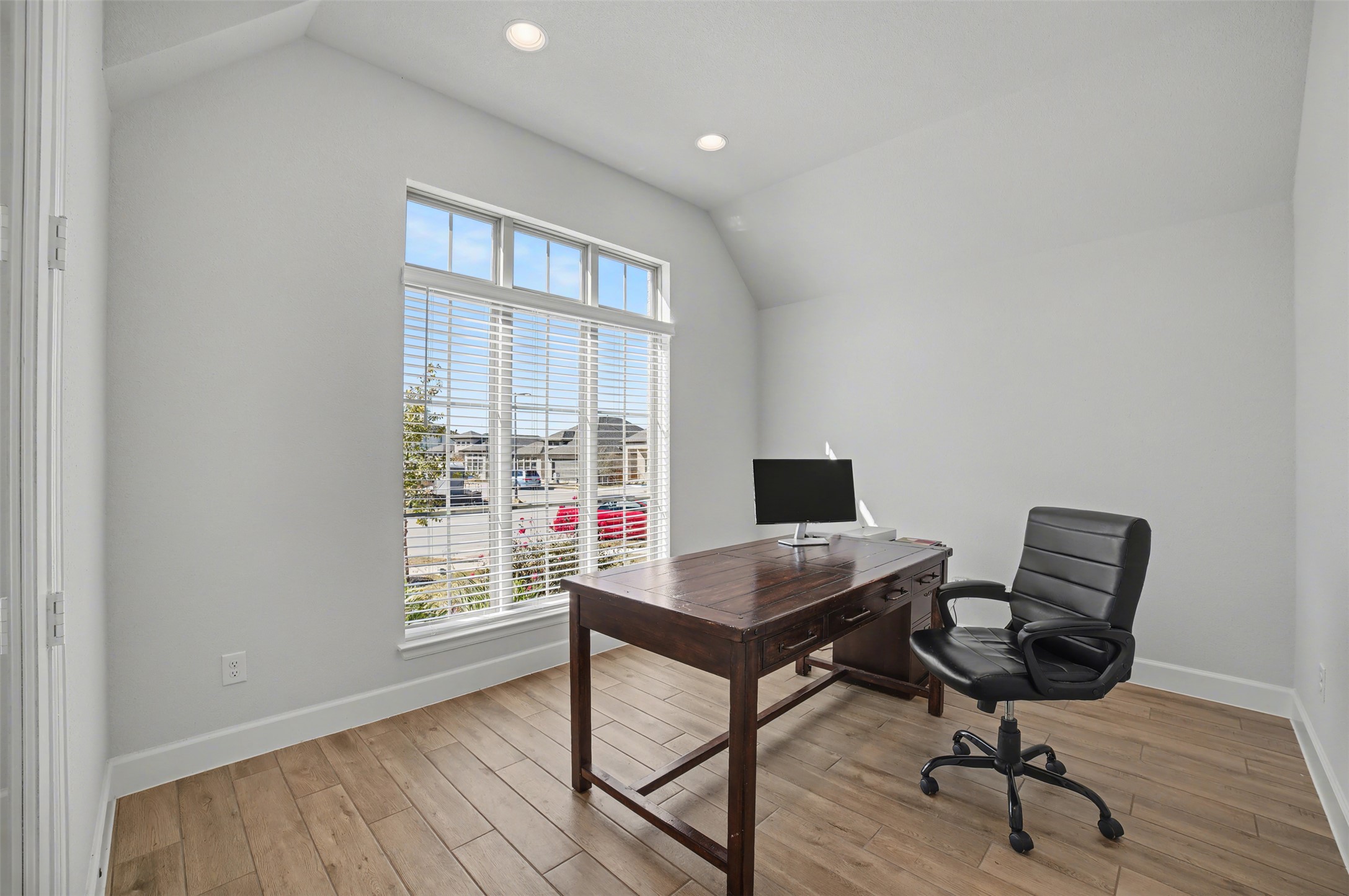 186 Prickly Poppy Loop Kyle, TX 78640 - Photo 13 of 40 a view of a workspace with furniture and a window