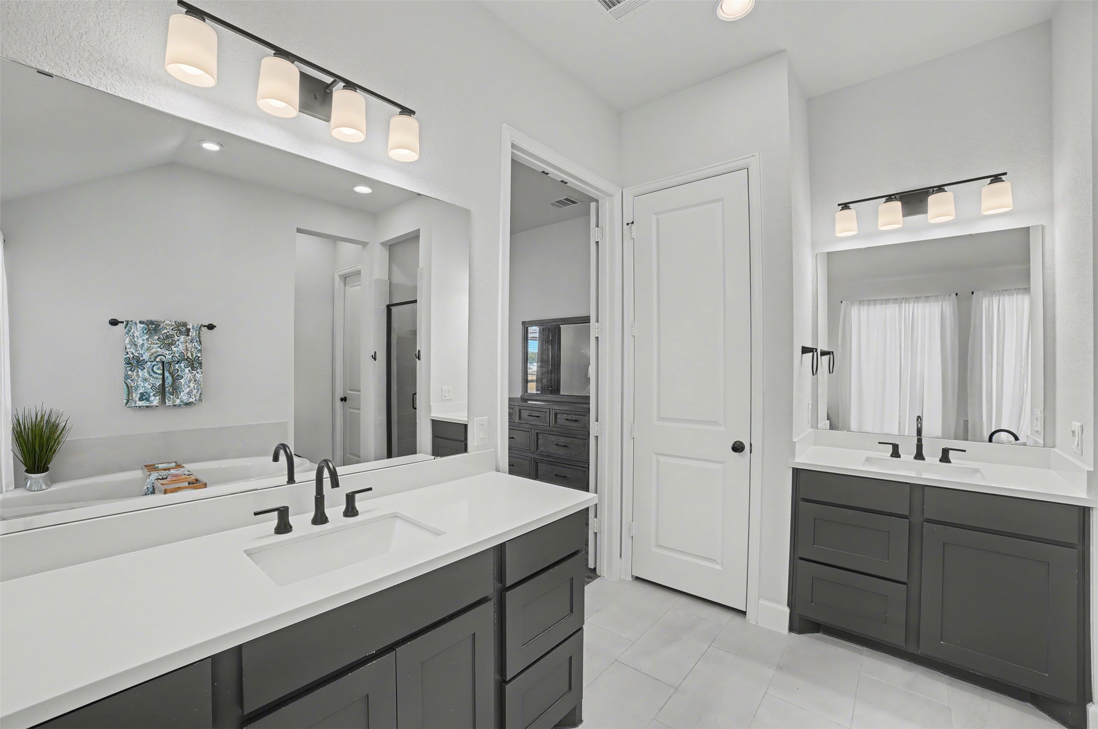 186 Prickly Poppy Loop Kyle, TX 78640 - Photo 18 of 40 a bathroom with a double vanity sink mirror and