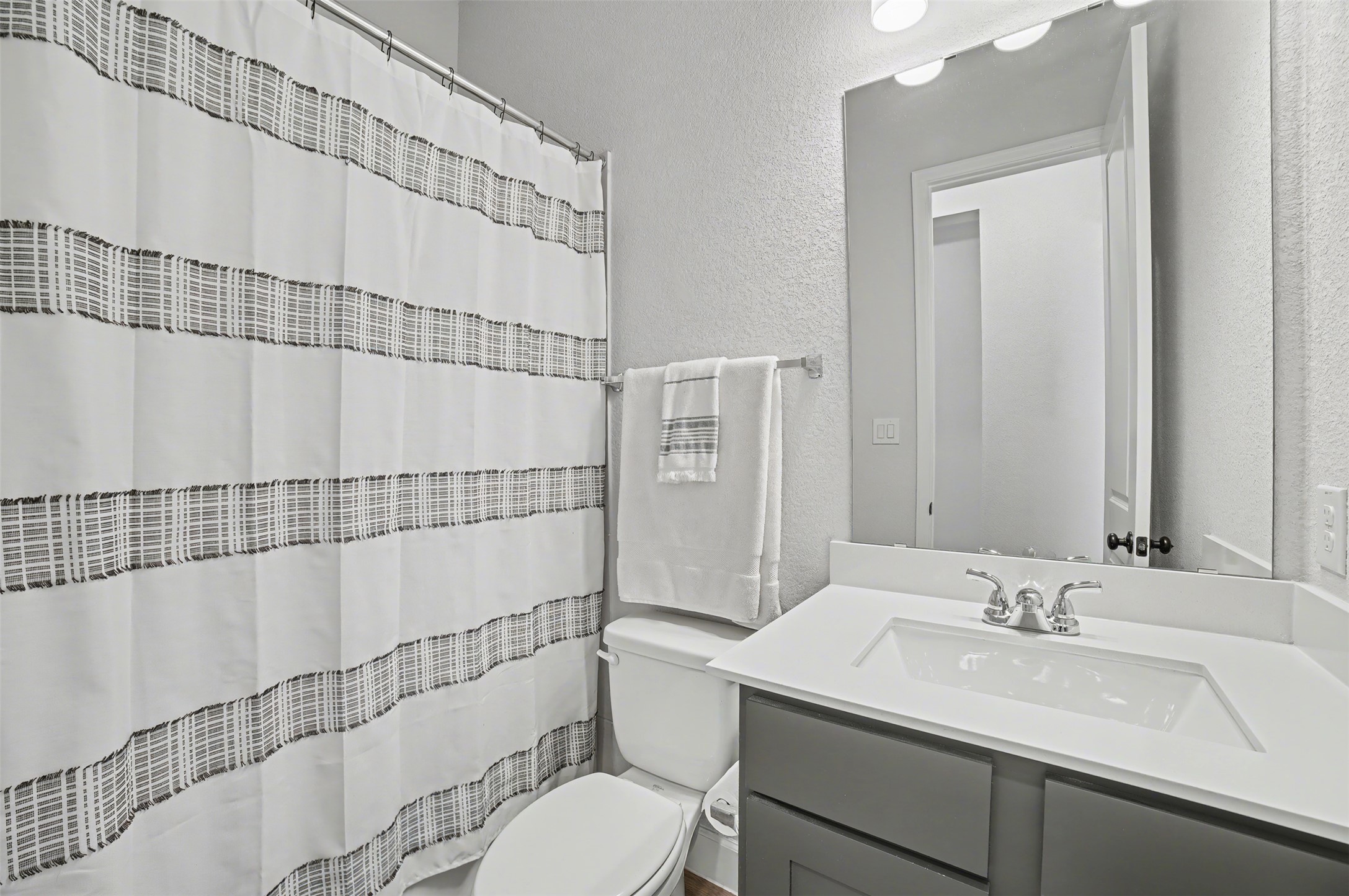 186 Prickly Poppy Loop Kyle, TX 78640 - Photo 24 of 40 a bathroom with a sink toilet and shower